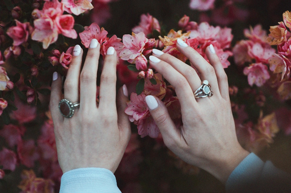 Beautiful manicured hands with flowers